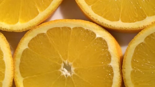 Orange Slices Closeup, Macro Food Summer Background, Fruits Top View. Rotate