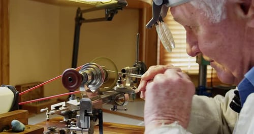 Craftsman Working on Lathe Close Up in Workshop