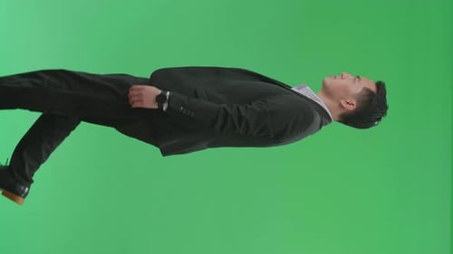 Side View Of Asian Business Man Walking On Green Screen Chroma Key
