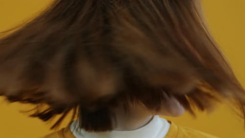 Young Adult Woman Shakes Head And Smiles
