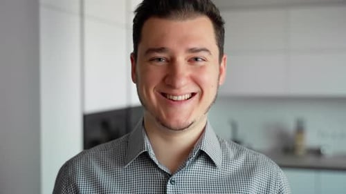 Man Smiling in Kitchen, Close Up Portrait