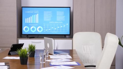 Modern Conference Room with Company Data Display
