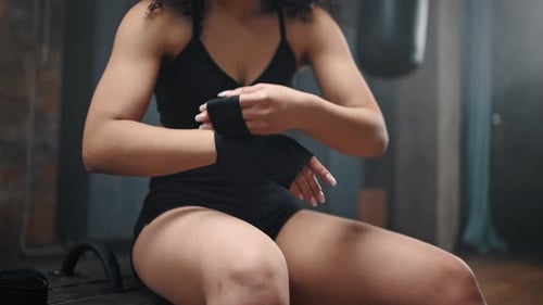 Young Adult Wrapping Hands for Boxing Training