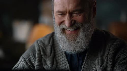 Smiling Senior Adult Man with Gray Beard Indoors