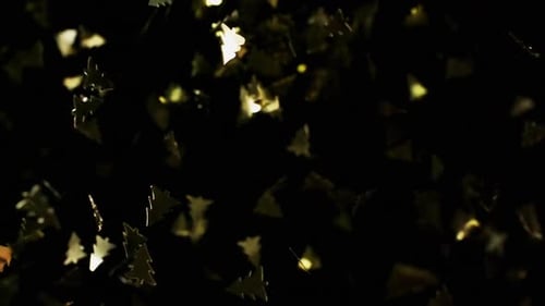 Golden Christmas Tree Particles Flying After Being Exploded, Bright Confetti Bouncing on Black
