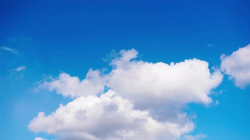 Clouds Drifting Peacefully in a Blue Sky
