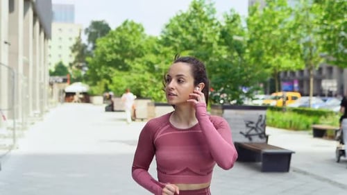 Young Active Motivated Fit Woman Runner Jogger Running in Urban City Park