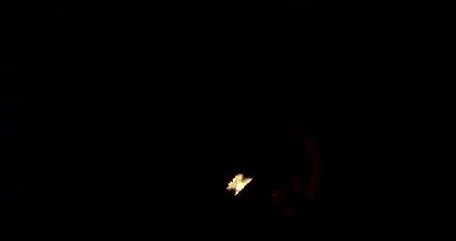 Man Fire Breathing in Dark Forest at Night