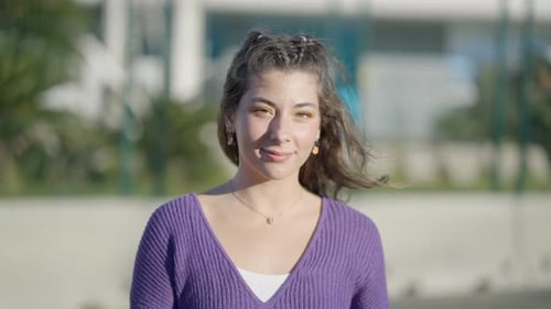 Close Portrait Shot of Darkhaired Teenage Girl in Purple Top Outdoors