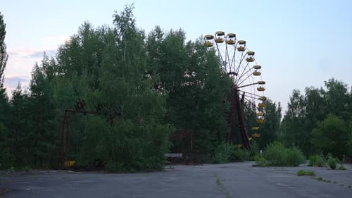 Abandoned Ferris Wheel Overgrown in Derelict Amusement Park