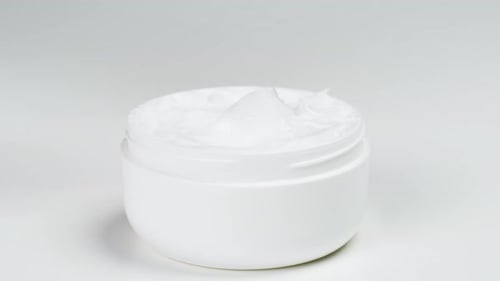 Finger Scooping Cream from White Container