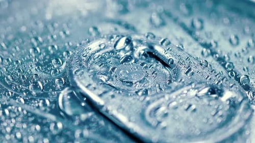 Aluminum Soda Tin Can Lid Cover of Soft Drink on Ice Goes Around the Circle