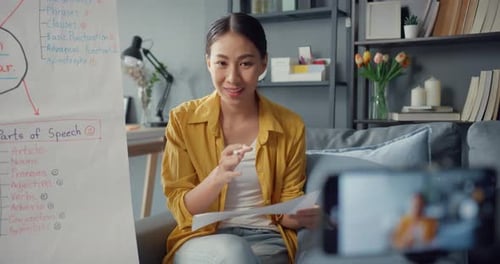 Enthusiastic Woman Giving Online English Lesson at Home