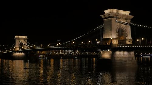 Famous Chain Szechenyi Bridge by night in Budapest Hungary and Danube 4K 2160p UltraHD ffps ootage -