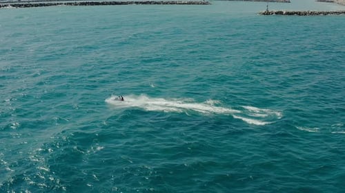 Jet Skiing Adventure on Blue Ocean Water