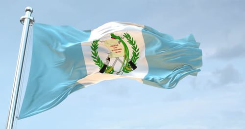 Realistic Waving Flag of Guatemala in Blue Sky