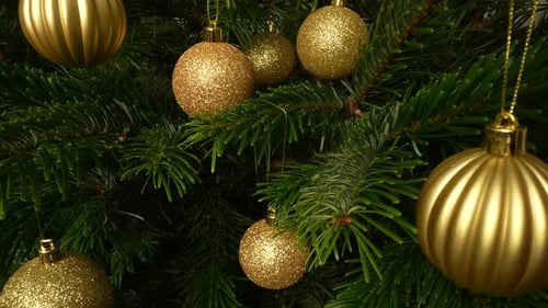 Golden Christmas Ornaments on a Green Christmas Tree