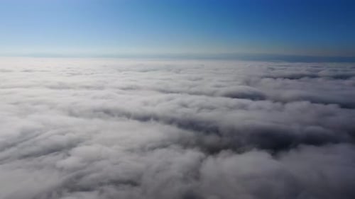 Aerial View of Fluffy White Clouds in Blue Sky