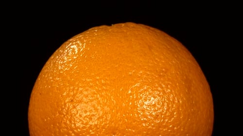 Close Up of an Orange Against Black Background
