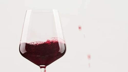 Red Wine Poured into a Glass
