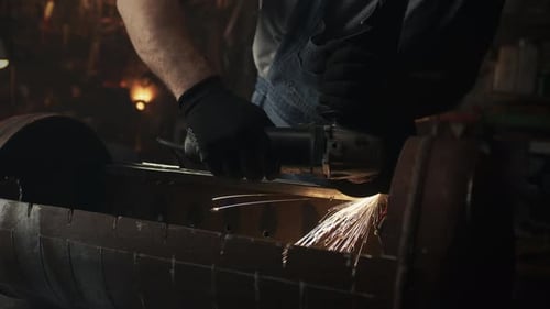 Man Starting Grinding Metal in Garage