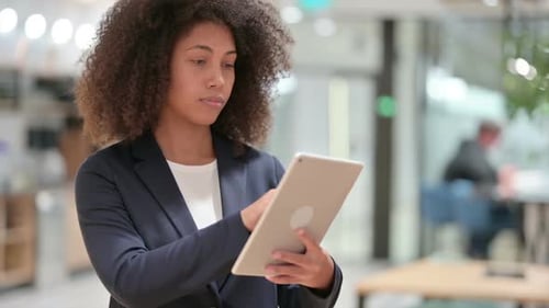 Young African Businesswoman Using Digital Tablet
