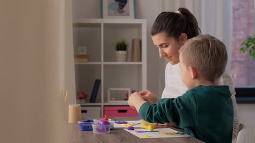 Woman and Child Doing Clay Art Together