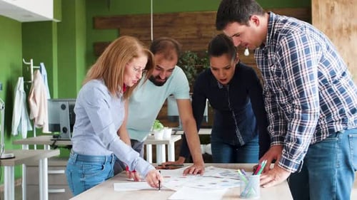 Team Collaboration on Business Strategy in Modern Office