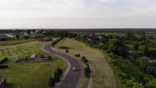 The Car Road Among the Fields Near the Houses in the Riverbank and the Buildings of the Old Fortress