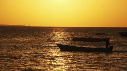 Silhouette of Fishing Boats Anchored at Sunset in the Indian Ocean Zanzibar