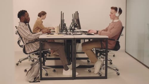 Young Adults Working in Modern Bright Office