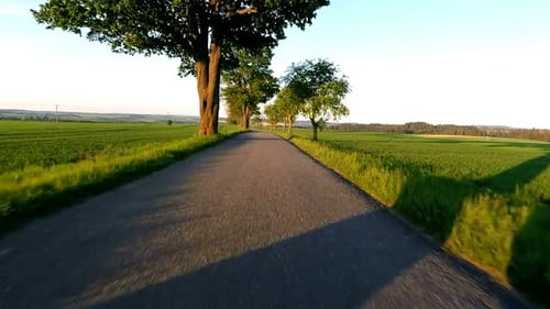 Car driving in spring time in rural countryside