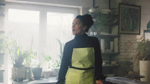 Woman Is Dancing and Singing In Pottery Studio