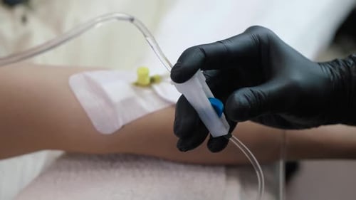 Administering Intravenous Drip in a Hospital Setting
