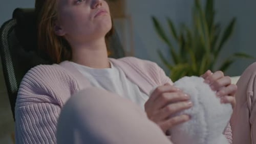 Young Woman Relaxing With Stuffed Animal
