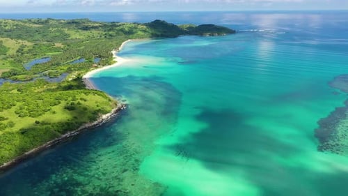 A Tropical Island with a Turquoise Lagoon and a Sandbank