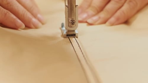 Closeup of sewing machine working part with leather. Sewing machine