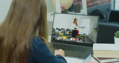 Student Attends Online Class on Laptop