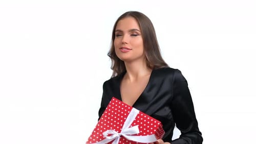 Happy Woman Holding Gift on White Background