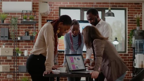 Business Team Collaborating on Data in Modern Office