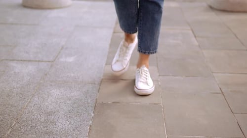 Close Up Caucasian Woman in Casual Shoes Walks on the Street