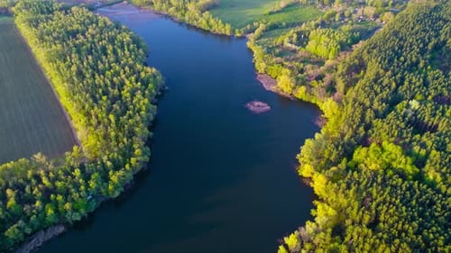 Flying Over the Beautiful Spring River. Aerial Camera Shot. Ukraine