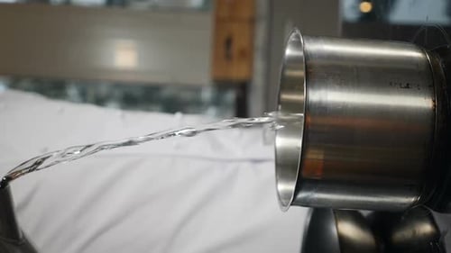 Pouring Clean Water Into Saucepan