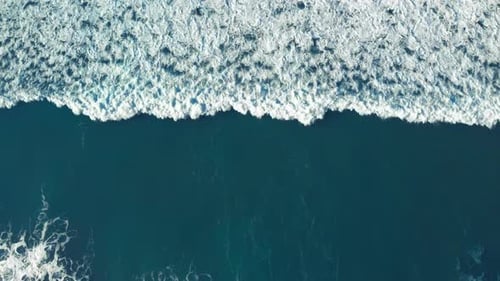 Aerial View of Ocean Waves Rolling In