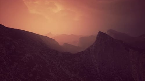 Dramatic Sky Over Rocky Mountains at Sunset