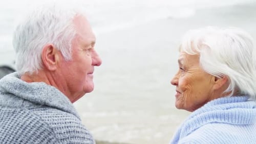 Senior Couple Sharing Tender Moment on Beach