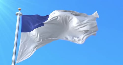 Christian Flag Waving in the Wind Against a Clear Blue Sky