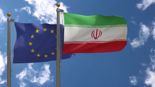 European Union and Iran Flags Waving in Wind
