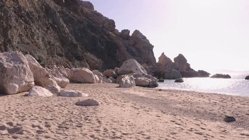 Tropical Island Beach with Rocky Shoreline