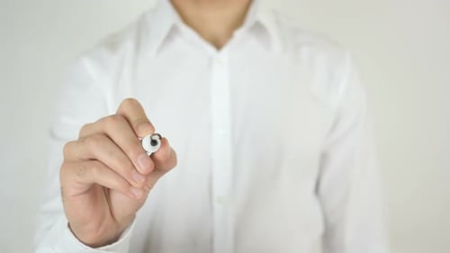 Hand Writes Solution on Glass Surface